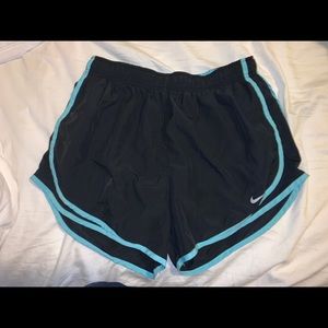 Black nike shorts with light blue trim